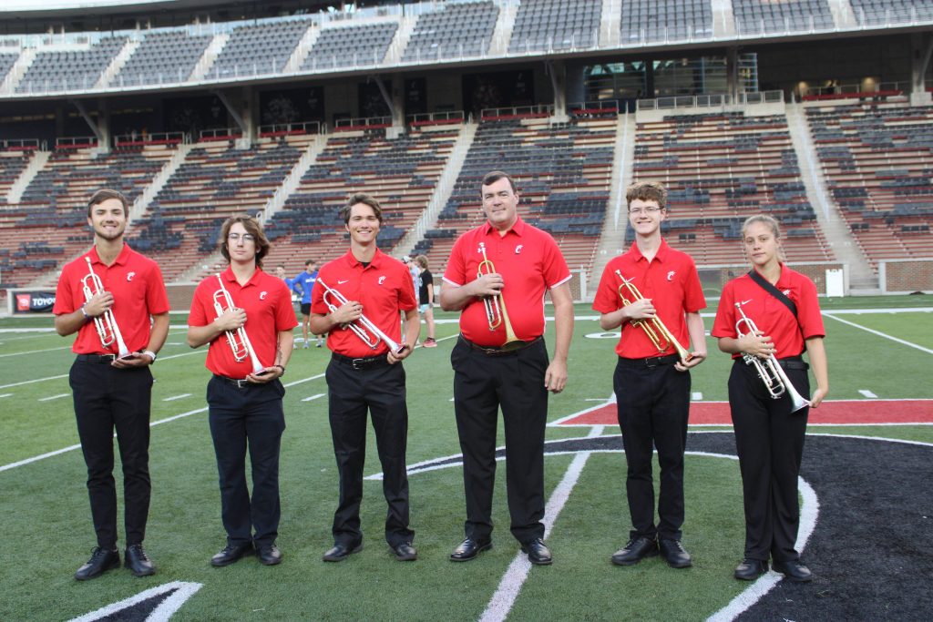UC trumpet players pay tribute at the end of the stair run.